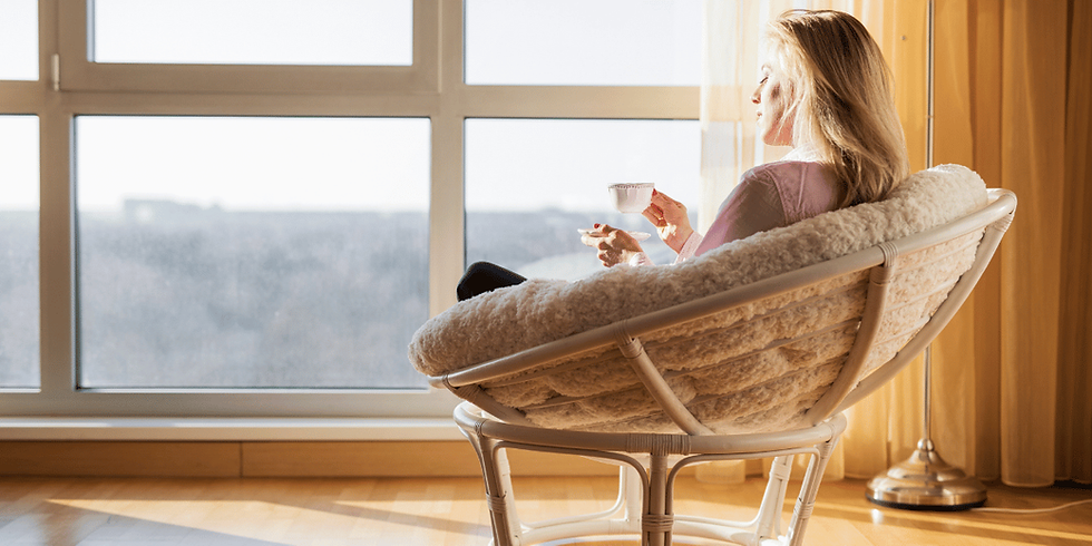 Person sitting peacefully with a cup of tea after practising anxiety relief techniques.