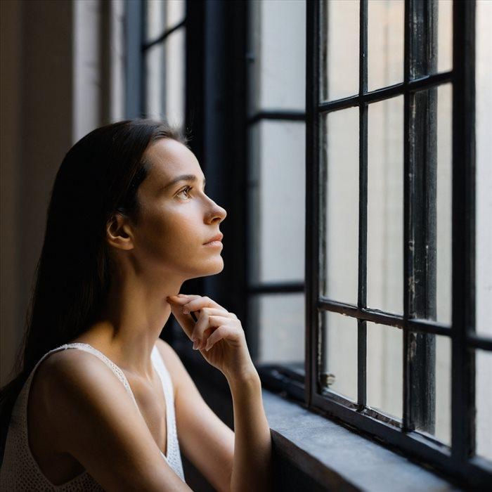 Woman quietly reflecting on her relationship