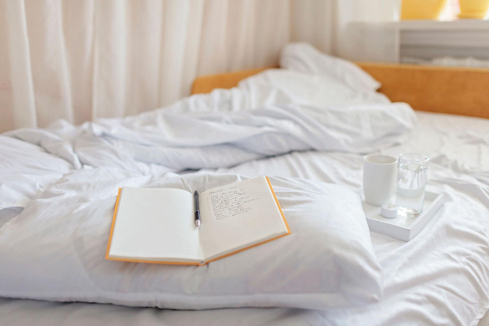 Open journal on an unmade bed representing self-reflection and evidence journaling while overcoming self-doubt.