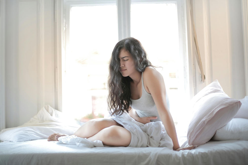 Woman experiencing stomach discomfort associated with anxiety