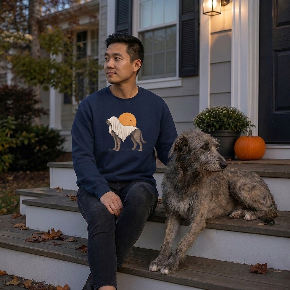 Thumbnail: Man sitting on front steps wearing the "Wolfhound Haunting" sweatshirt beside an Irish Wolfhound.
