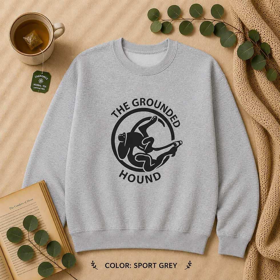 Thumbnail: Sport Grey Gildan 18000 sweatshirt laid flat featuring the Grounded Hound Logo