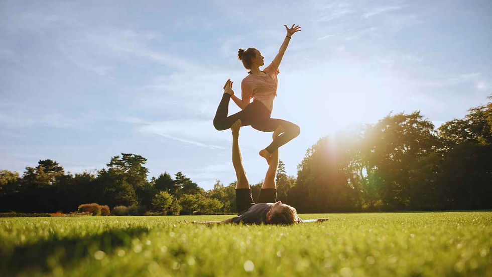 healthy couple doing Acro yoga