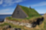Traditional turf house in Iceland by the coast