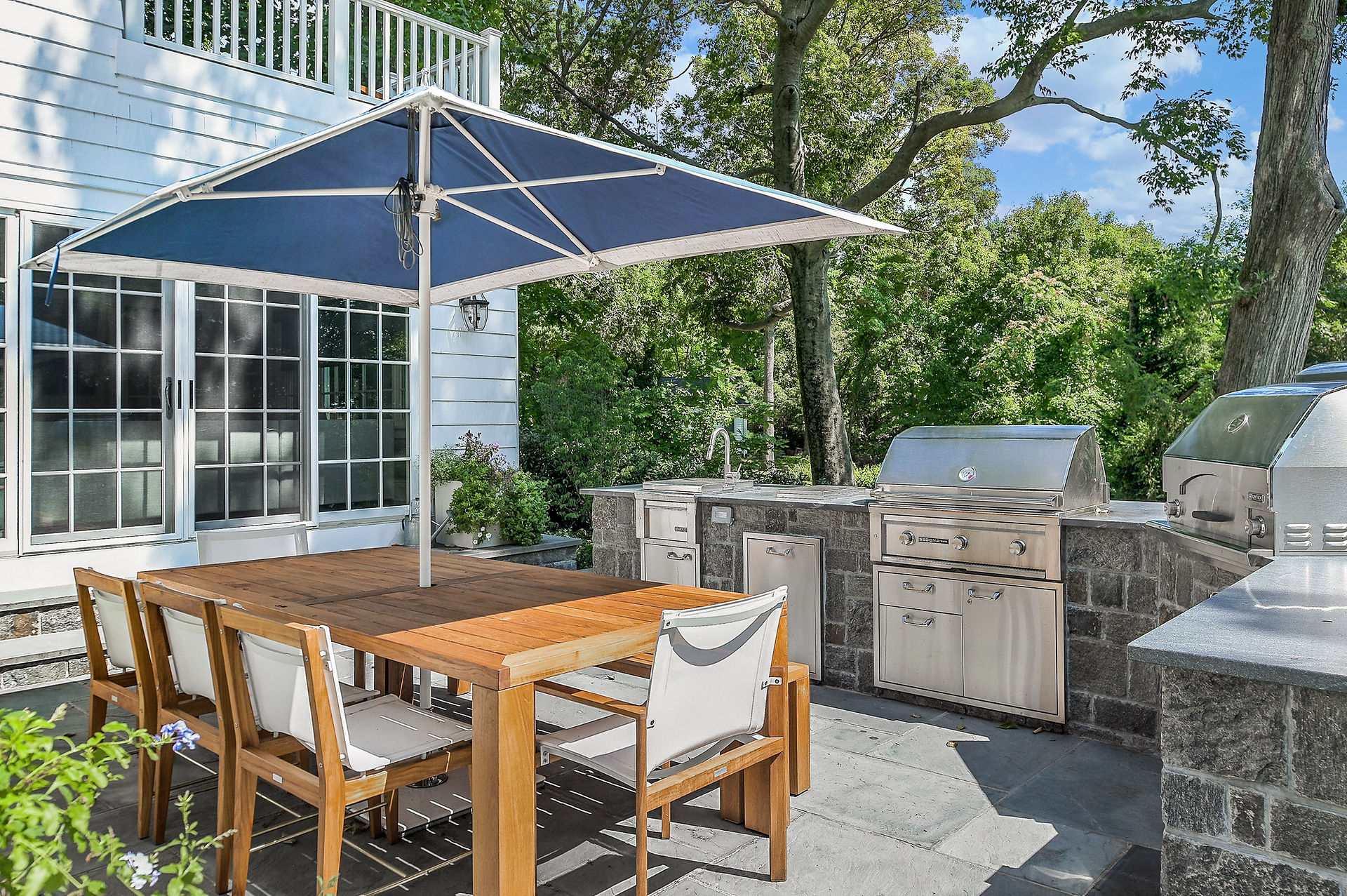 New outdoor kitchen and eating area expands the use of the backyard space