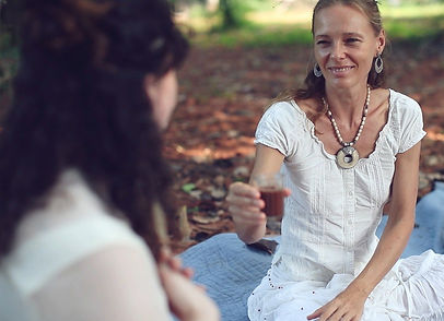 Prem shakti offering hot chocolate cacao drink to the bride circle