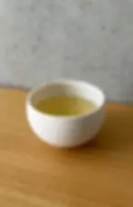 Japanese sencha tea in a white ceramic teacup