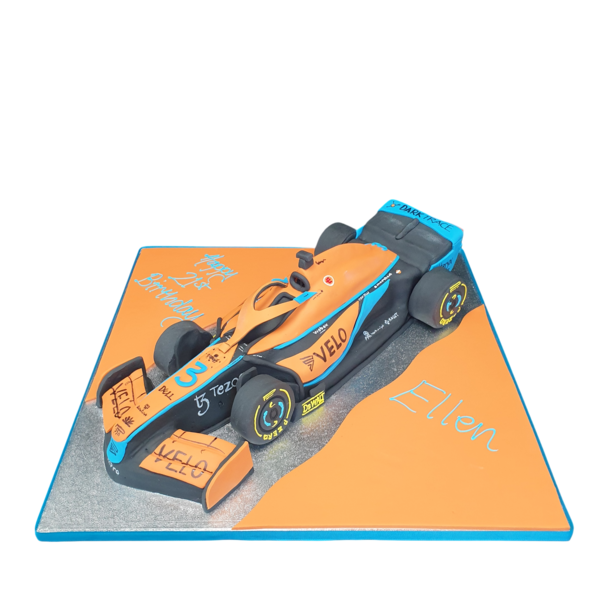 A visually stunning buttercream cake designed as a Formula 1 car inspired by McLaren racing team. Great for motorsport enthusiasts and special occasions.