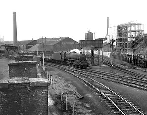 A mixed goods train heads north _1196x93
