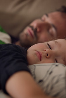Father and child sleeping