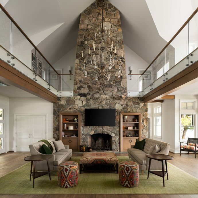 Architecture photography of Lake Winnipesaukee great room with vaulted ceiling and stone fireplace