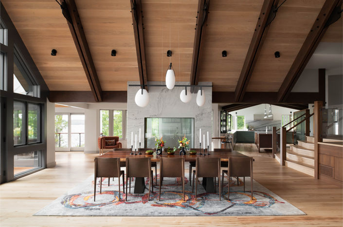 James Reed Open dining room with wood beam ceiling and pendant lights in a lakehouse on Lake Sunapee, New Hampshire.Photography -Architecture Photography + Design Photography- New Hampshire, Maine, Massachusetts, Boston, New England, Vermont, New York, Connecticut  