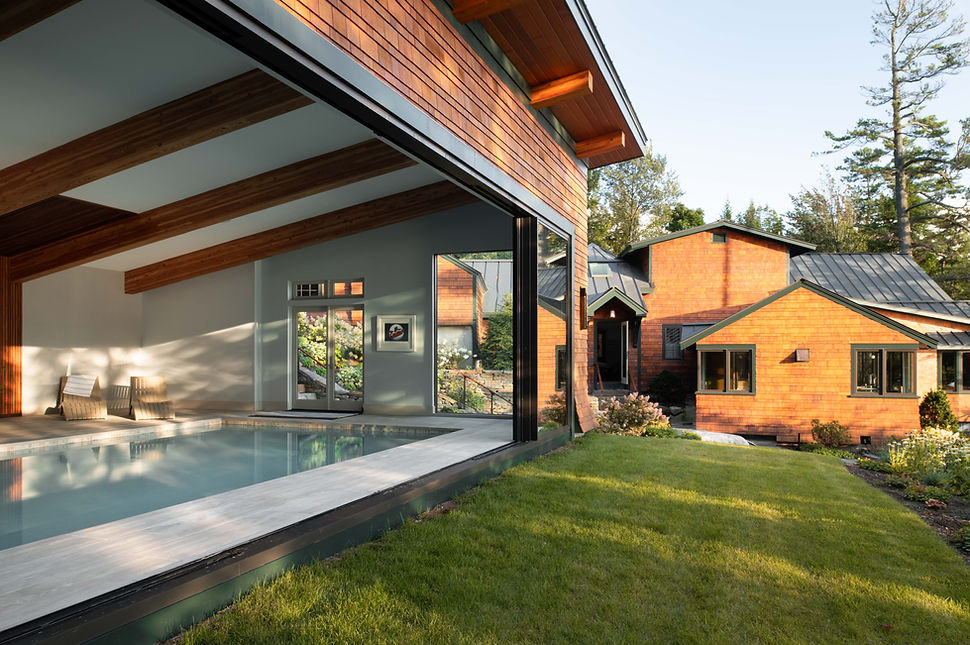 Lake Sunapee lakefront estate in low directional light through mature pines, New Hampshire — McGray & Nichols design-build,