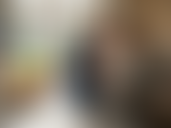 Couple checking home energy monitor in kitchen