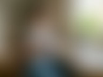 Woman comparing battery manual at desk