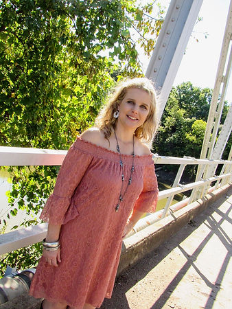 Kelly posing on old bridge
