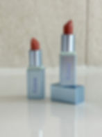 Two Kosas lipsticks in their new packaging. 