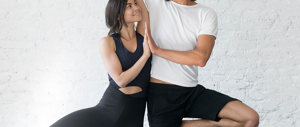 Couple Doing Yoga Pose
