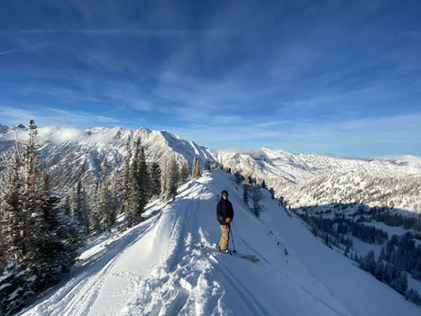 man on skis on top of mountain