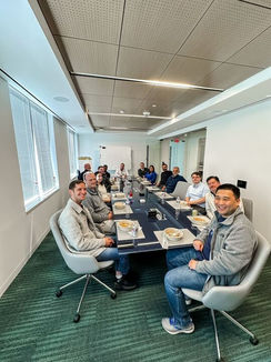 group meeting around long table with 12 people