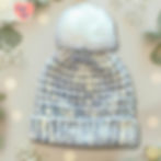 Crochet beanie with pom pom, includes Hugs & Wool text. Whispering Frost Pom Pom Crochet Beanie.