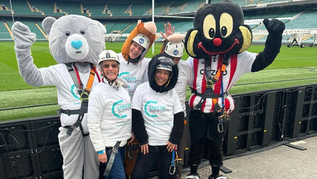 Cancer Support UK supporters and mascot at Twickenham Zip Wire 2025