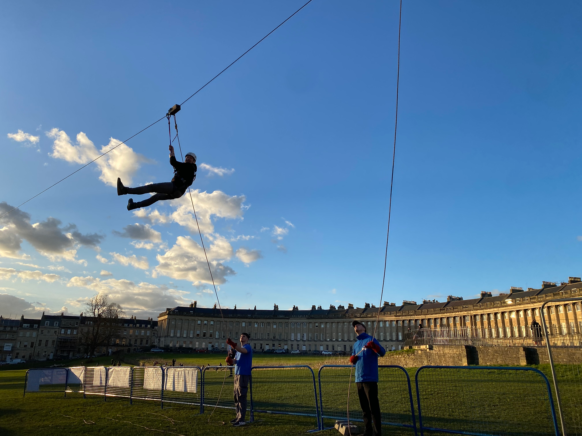 A participant coming down the wire, with a view of Royal Crescent in the background