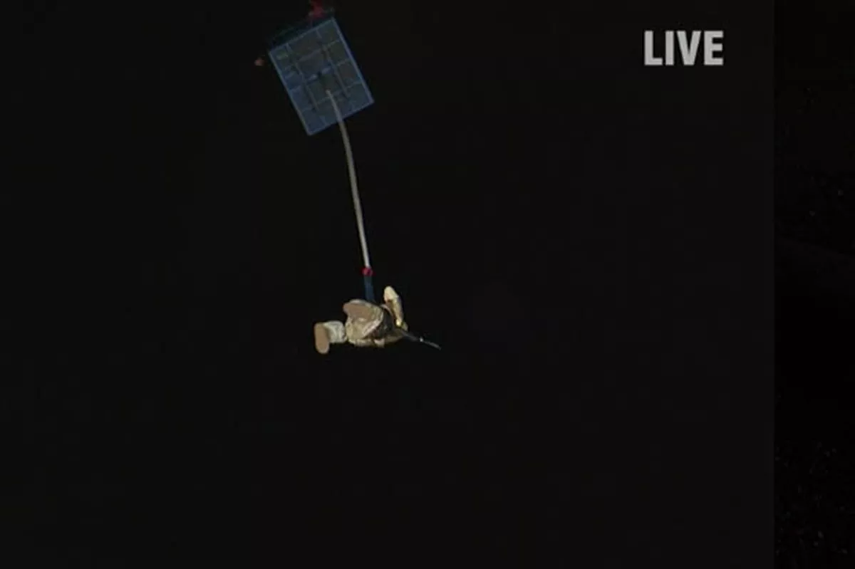 Shot looking up, showing the bungee cage and Stephen Mulhurn mid air after being catapulted by a reverse bungee