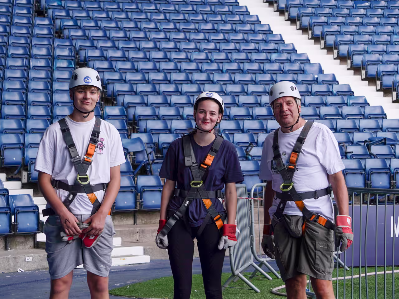 Fundraisers smiling in the stands before their abseil 