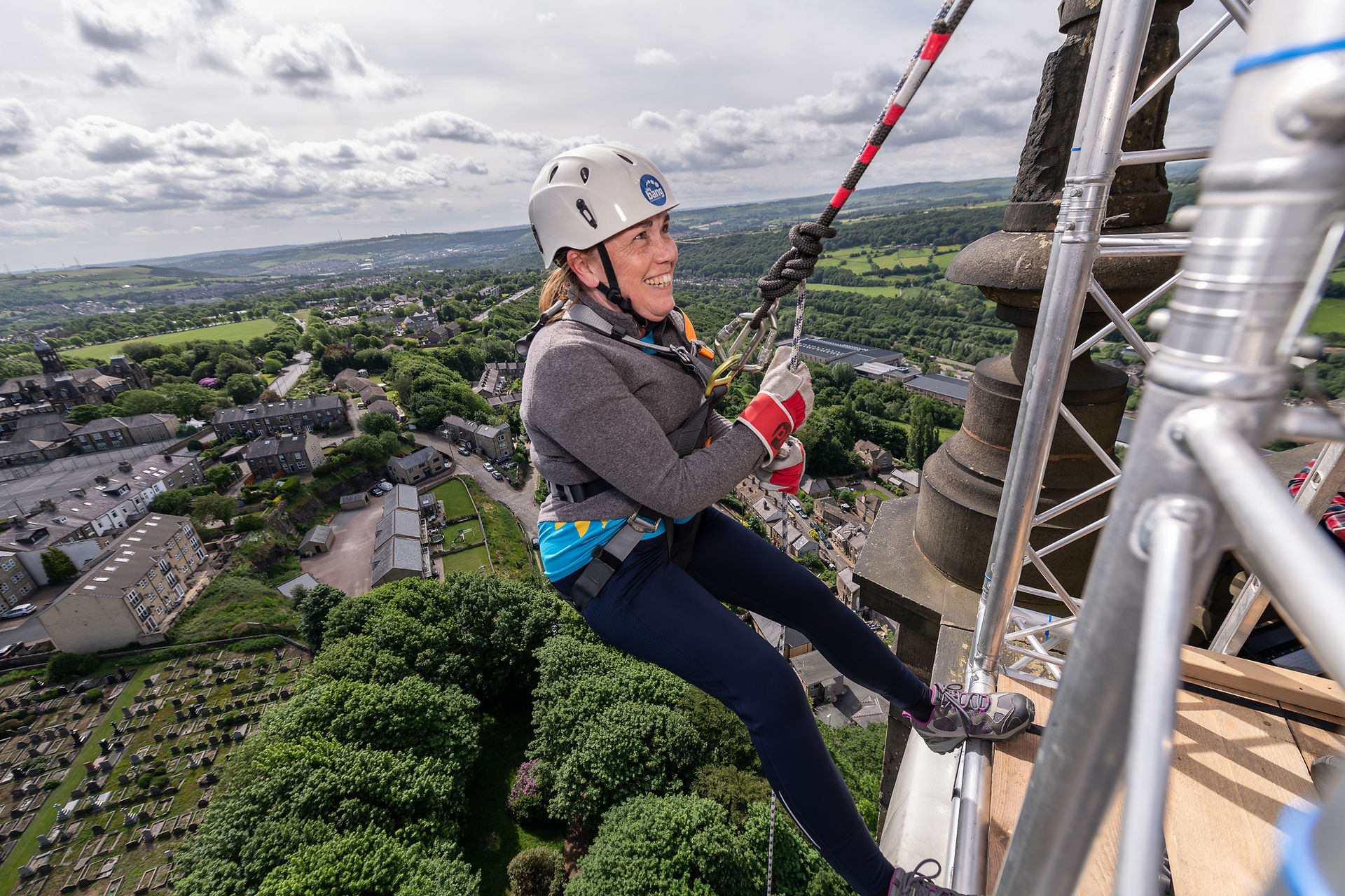 Abseiler on the edge of Wainhouse Tower Abseil 