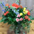 The Barefoot Flower Garden arrangement captures the essence of bohemian chic with its colorful flowers.
