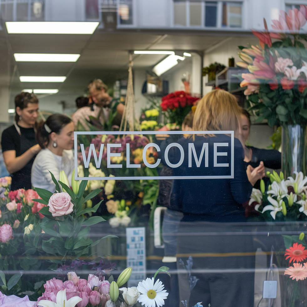 Buying flowers near me in Downers Grove has never been easier than at 'Walden Floral Design' . A view of our large windows showcasing colorful floral displays.