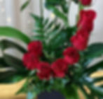 Beautiful arrangement titled 'Ooh La La in Red' with a dozen red roses, a display of elegance and grace.
