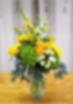 Blonde Ambition bouquet: Baby yellow roses, green hydrangea, and assorted flowers come together for a truly charming design.