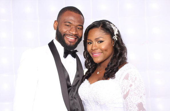 Mercy Chinwo with her husband at their wedding. 