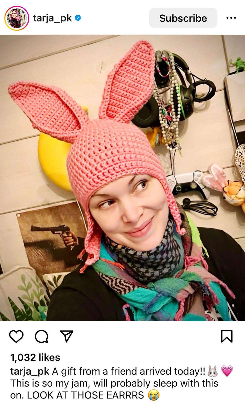 Thumbnail: Bright pink bunny ear hat worn by lady showing upright ears, handmade crochet festival and cosplay accessory.
