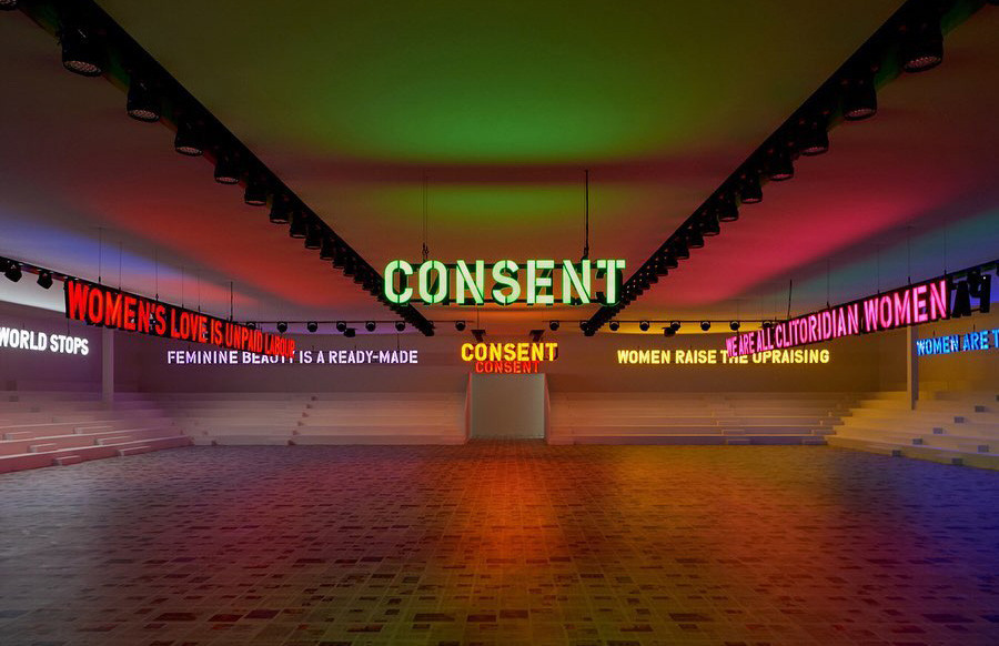 Neon signs saying "Consent" in an empty room for Christian Dior fashion show