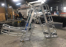 Metal framework of a large dimensional letter A during sign fabrication in a production workshop.