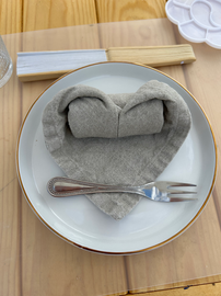 heart folded napkin on a plate
