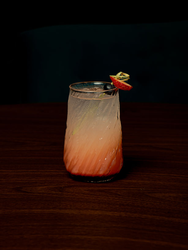 trawberry Shughal mocktail at Café Karak — a bright, refreshing drink made with muddled strawberries, citrus, and soda over ice.