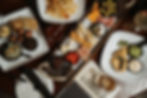Flat lay of assorted share plates served at Romero’s Lounge & Cocktail Bar