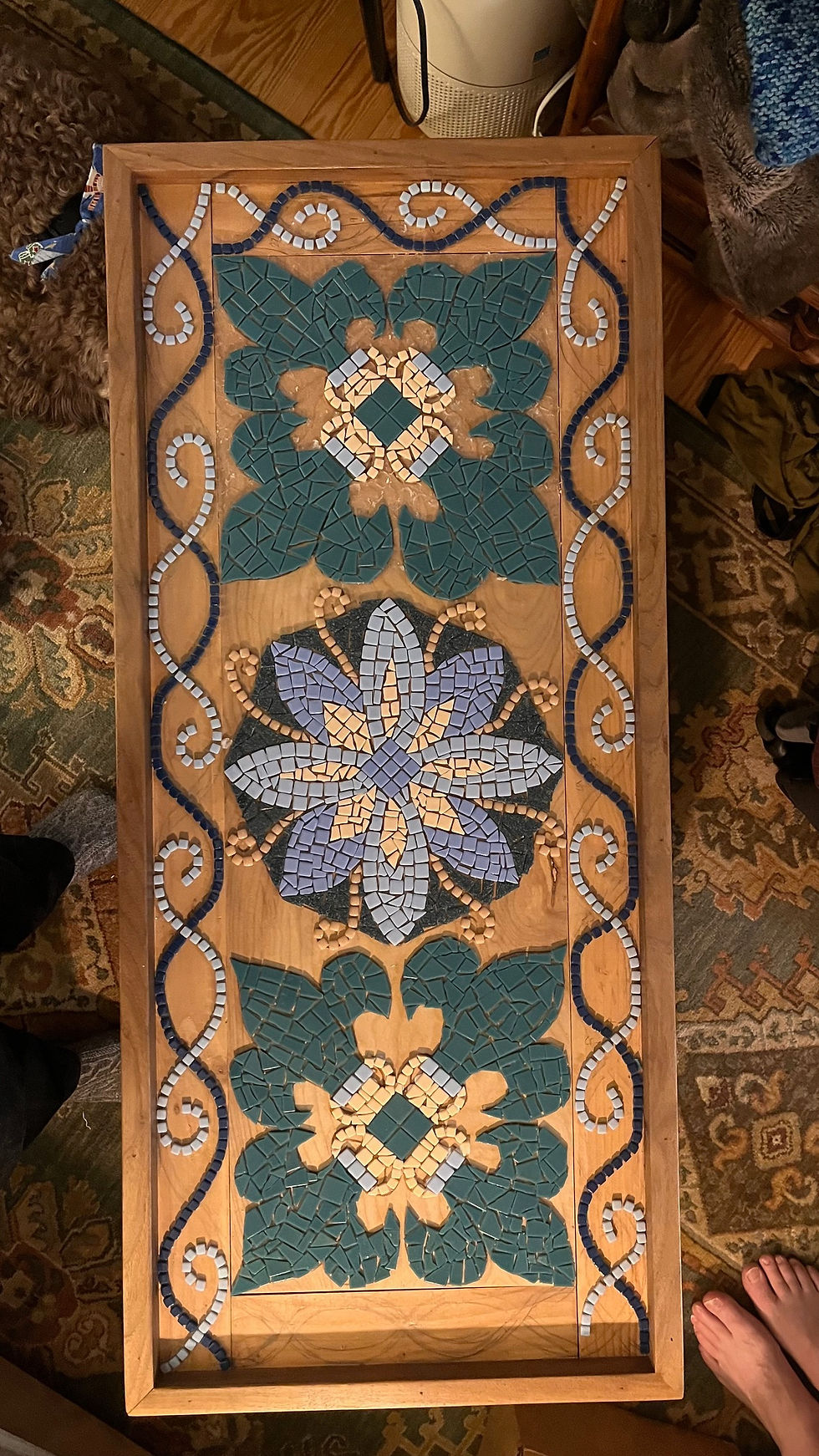 Further along in the laying of tiles. At this stage, it is very important to think about what background color is going to complement the main motifs. 