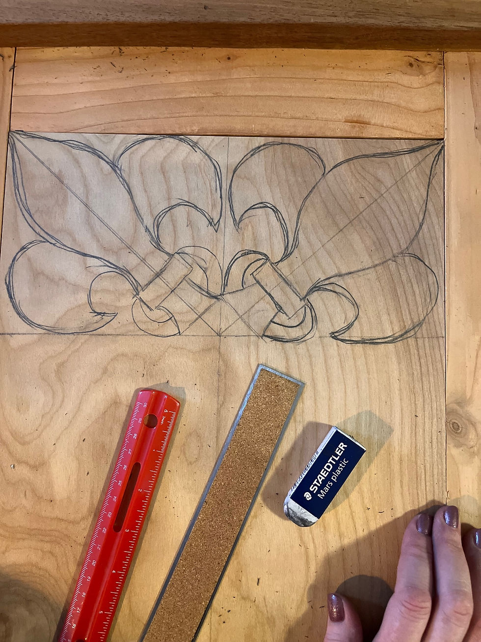 I began by sketching out design motifs. The customer who I was making this for mentioned that he loves the Fleur de Lis image so I wanted to make this a major part of the design. 