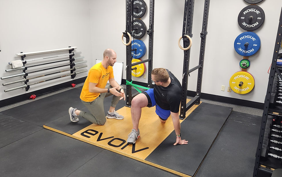 Physical therapist helping patient on exercises.