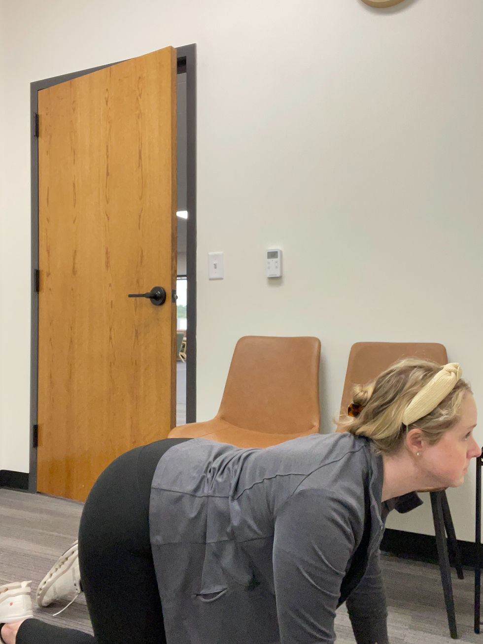 Inhale as you dip your back, allowing your stomach to fall toward the floor. Lift your chest and gaze slightly upward.