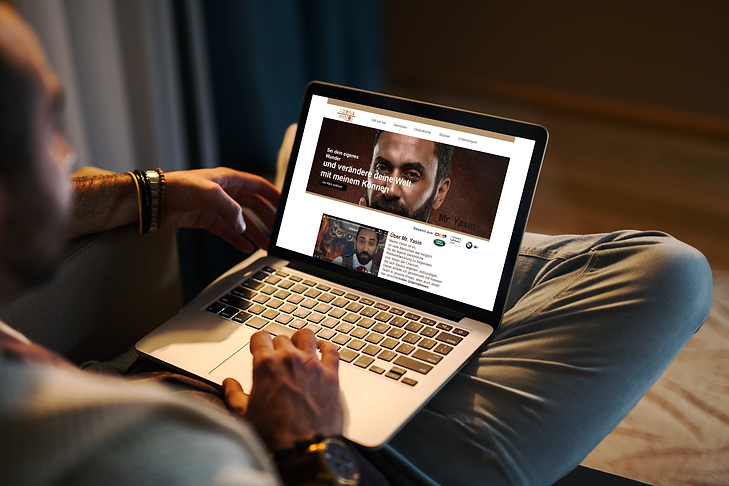 mockup-of-a-man-using-a-macbook-in-a-cozy-living-room-2324-el1.png