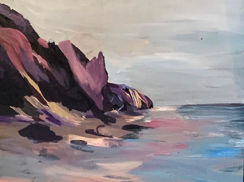 purple shaded cliffs and dunes with scattered rocks, pink sand down the beach on the ocean.