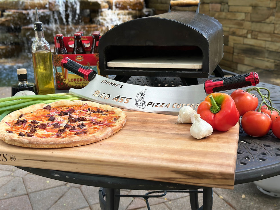 Image of a personalized Bad Ass Pizza Cutter in front of a grill
