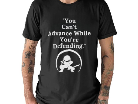 You Can’t Advance While You’re Defending Inspirational Motivational Unisex T Shirt