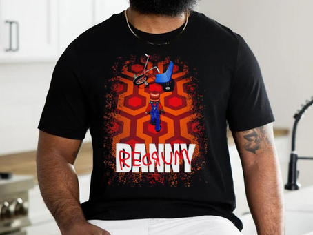 Danny Torrance walking toward his big wheel Redrum shirt